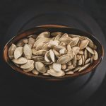 brown and white nuts on brown ceramic bowl